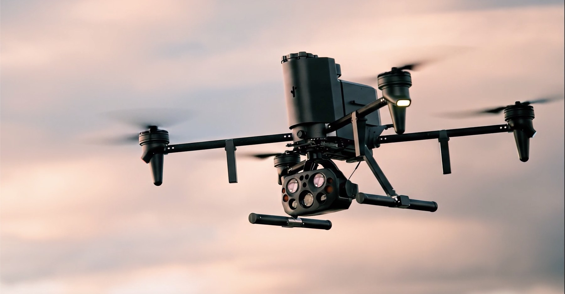 Flock Alpha drone in flight at golden hour