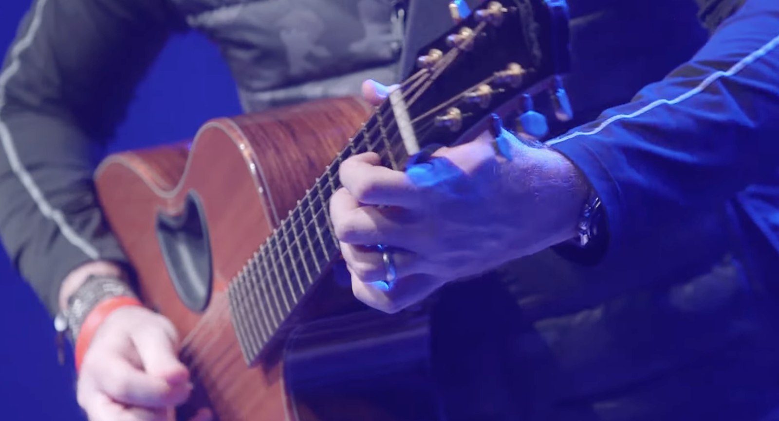 Detail of Corey Smith's hands on the guitar, live at Buckhead
