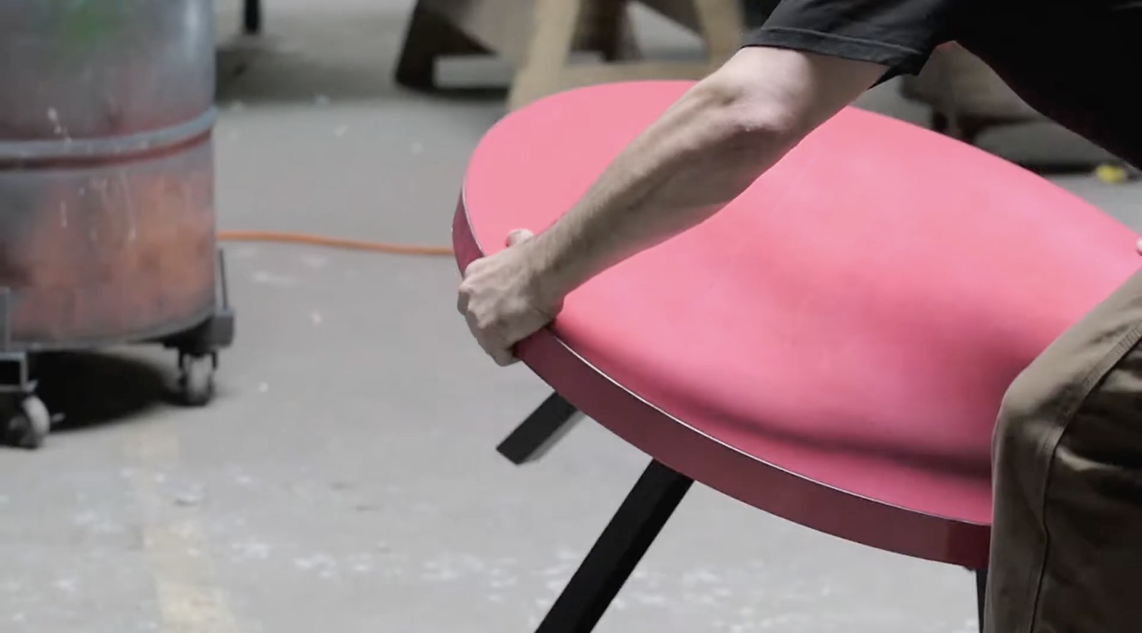 Still from Dangerous Color, showing painted furniture in the studio