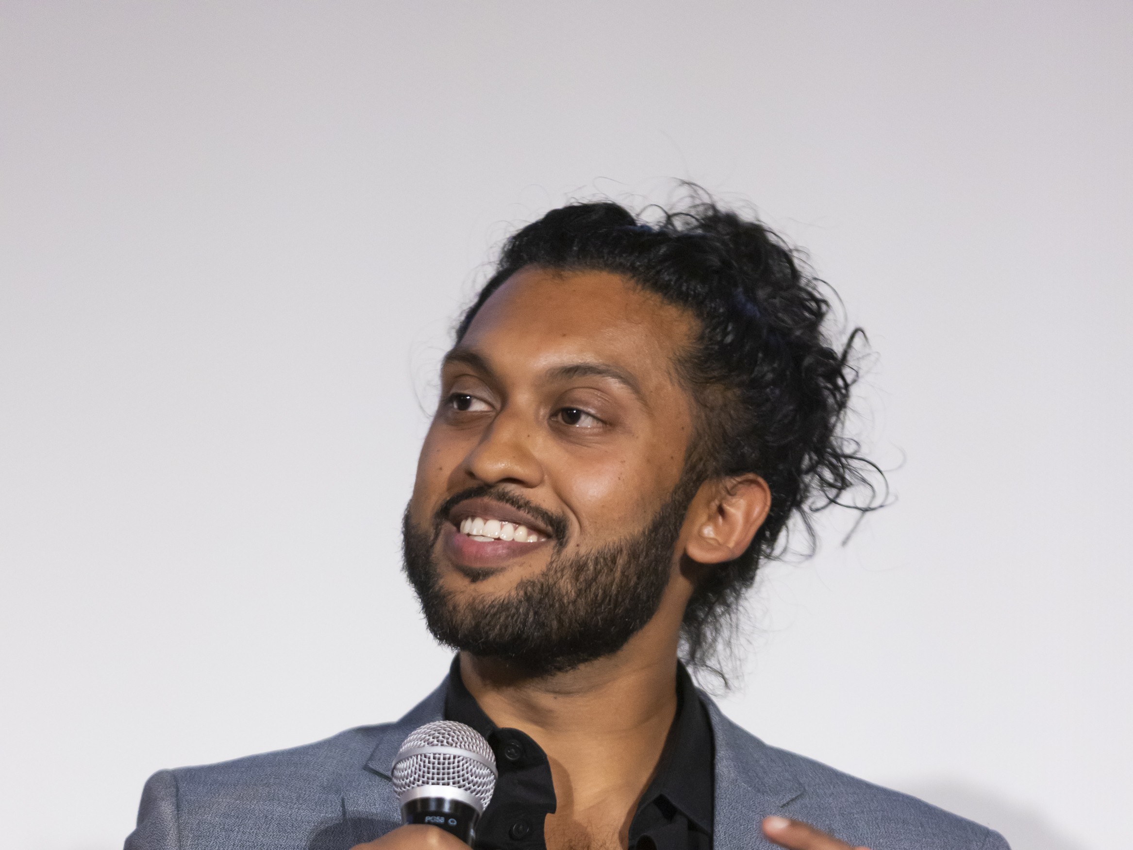 Abijeet Achar speaking at the Forgive Us Atlanta premiere