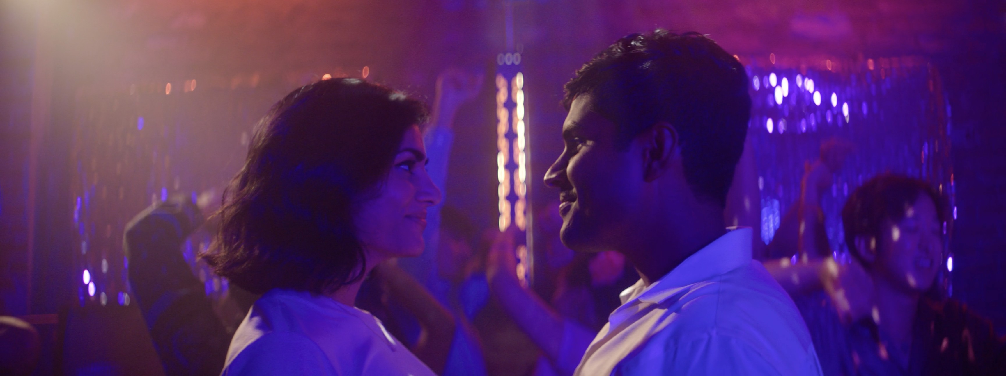 Still from Mysore Magic, a couple face to face on a dance floor